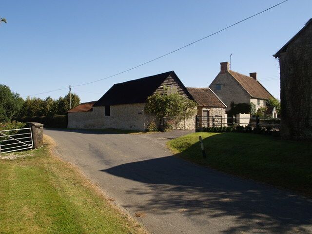 Two Bridges Farm The bulk of most of the buildings illustrated lies across the gridline in ST3421, but the walls and farmhouse facade facing the barn on the right are a metre or two inside ST3420. The Fivehead River is a mere metre or two away on the left, and in fact runs beneath the road wall opposite the end of left-hand building.