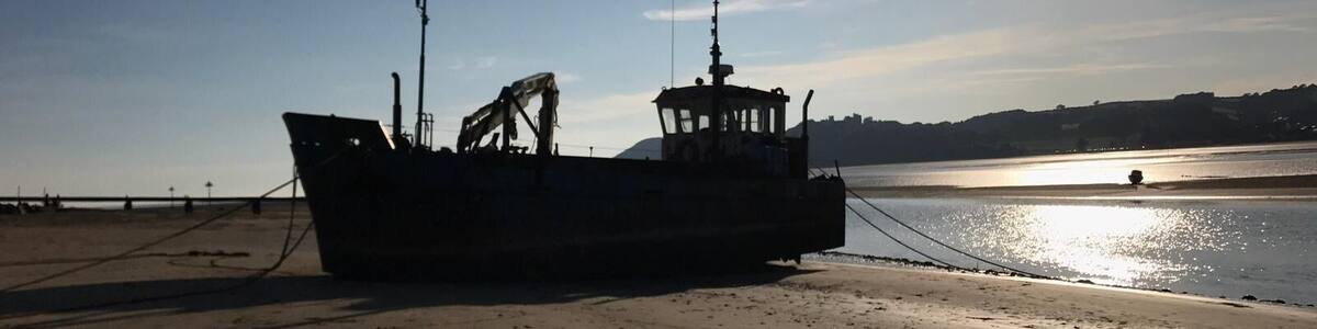 Taken at the seaside beach of ferry side. This boat has been there since I was young.