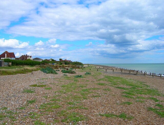 KIngston Gorse Beach The public footpath follows the greensward between the houses and the shingle beach. The houses are part of the private estate of Kingston Gorse.
