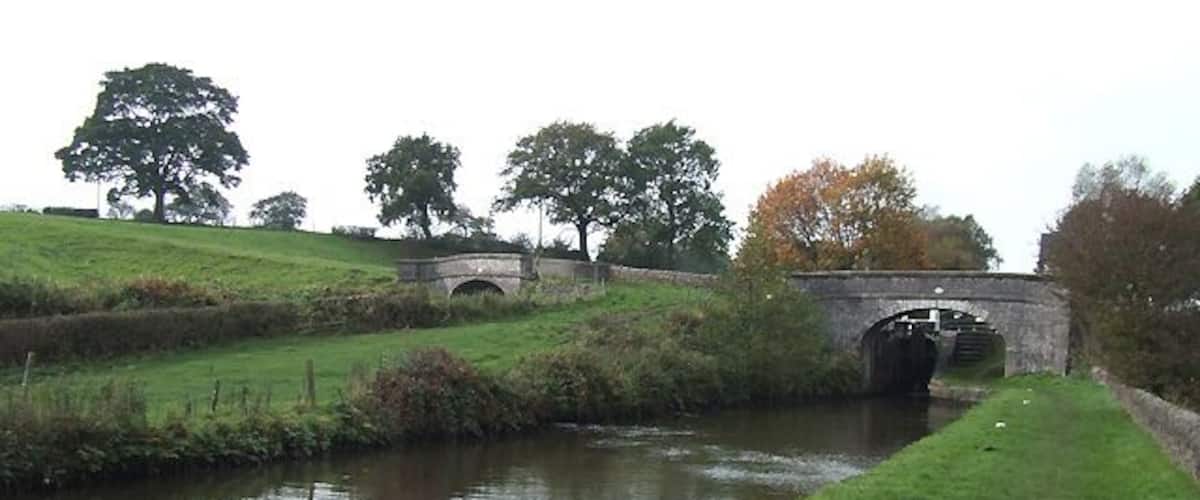 Hazelhurst Junction, Caldon Canal, Staffordshire The view shows the canal before Bridge No 36 in front the top lock, No 10, both on the main (Froghall) line.To the left is bridge No 1 of the Leek branch, its water being about eight feet higher than the foreground water.