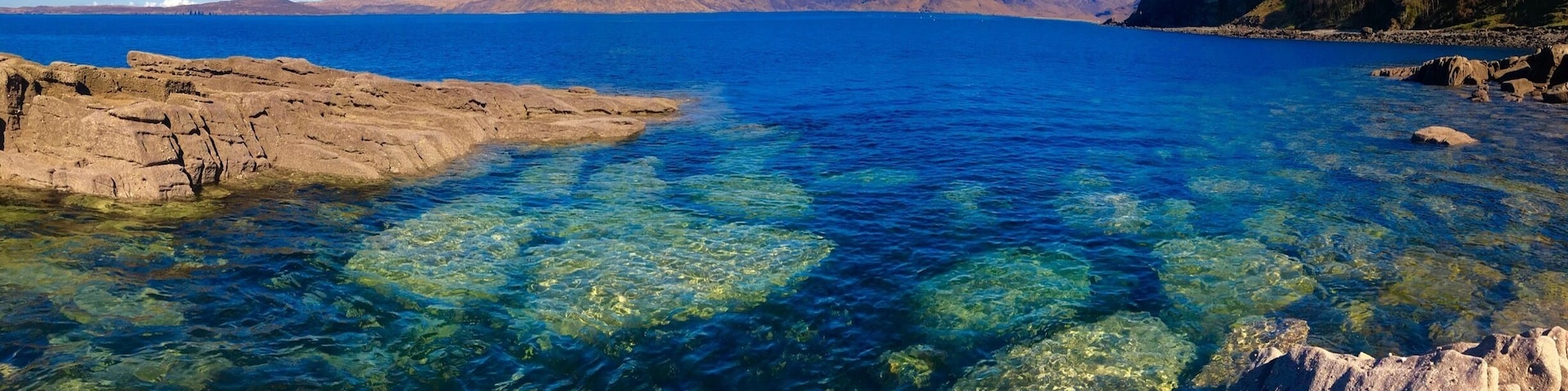 When the sky was just too blue in Elgol on the Isle of Skye the clear waters catch your attention. With the Cuillin range in the distance that fantastic rocky shoreline draws my attention. What’s missing form the photos it the local school is just off the harbor and the kids get to play here everyday when school in. What a place to grow up.
#BVSblue