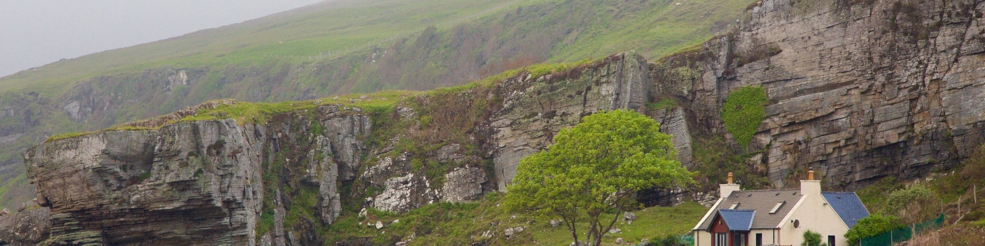 Elgol which includes rugged coastline, tranquil scenes and a house