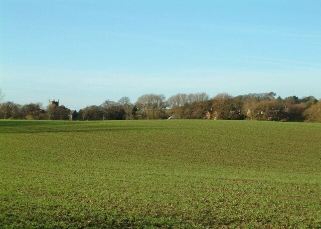 Farmland near Chebsey Looking across fields towards the village, with All saints church to the left.