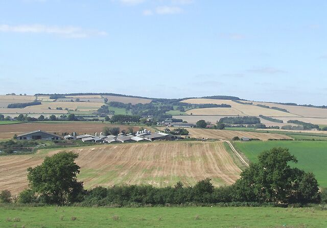 Corve Valley and Little Oxenbold Farm, Shropshire The stubble following cereal harvests is in many fields yet to be ploughed. Grass for cattle, and potatoes occupy other fields near this farm.