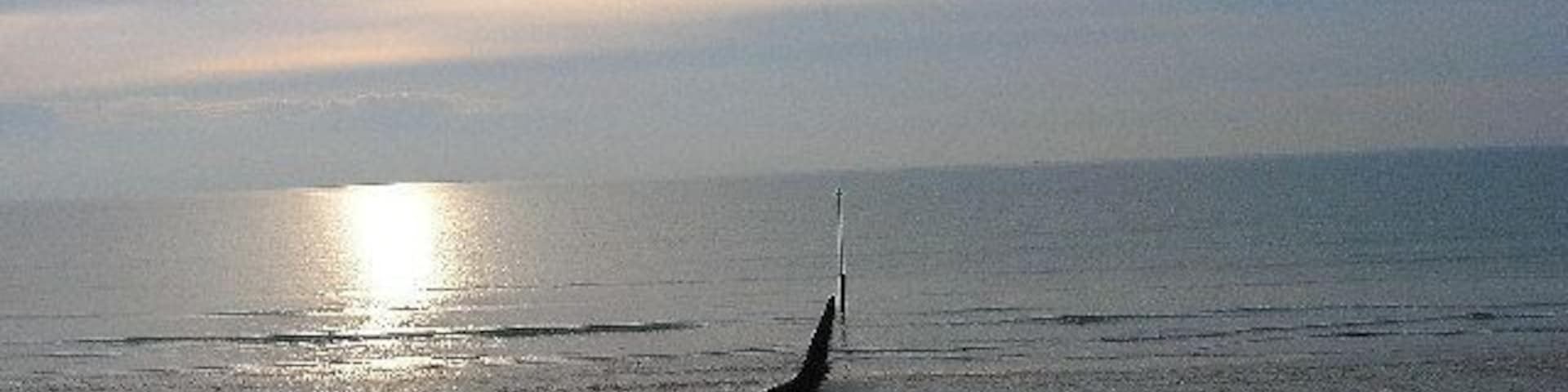 Bracklesham Bay. Looking south west onto a desolate beach on a cold winter's day.