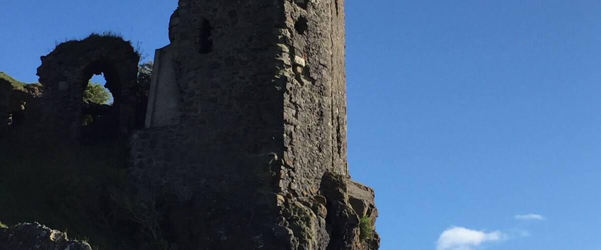 Walk the beach, climb up to the castle and scramble over the ancestral pile.