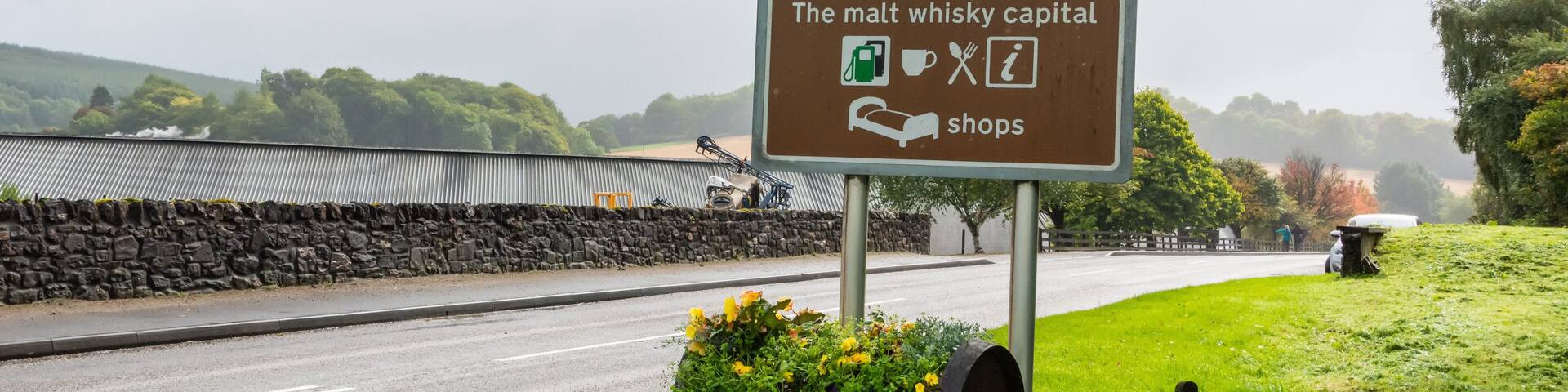 ‘Welcome to Dufftown. The malt whisky capital’ road sign in Dufftown, Scotland.
