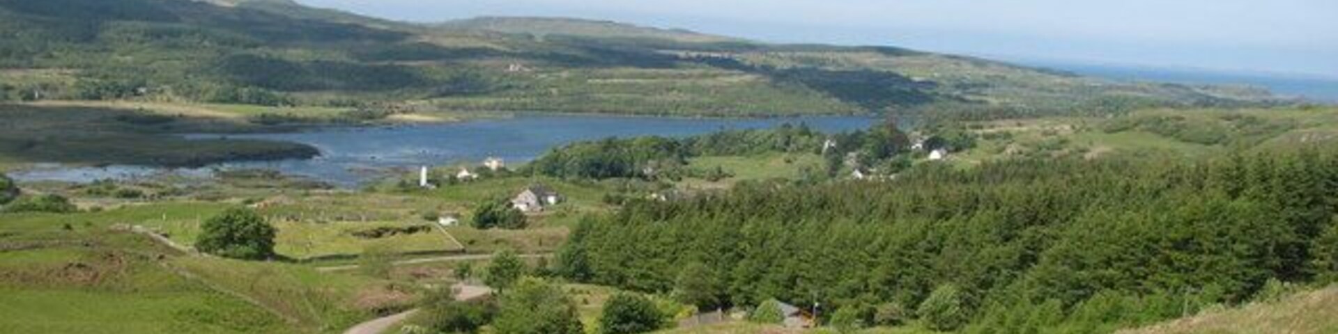 Dervaig Village This was taken from the viewpoint near the burial ground and shows the newly painted church Tower. It used to be plain grey.