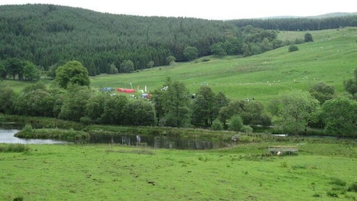 Loch in front of Craigengillan House An ornamental loch in front of Craigengillan house. The tents in the background are part of the Scottish Orienteering Championships.