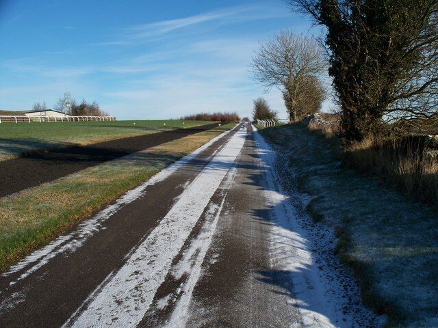 Footpath at Jackdaws Castle The road, the route of both the Gloucestershire Way and the Diamond Way long distance paths, continues to ascend Cutsdean Hill. The all-weather gallops are to the left.