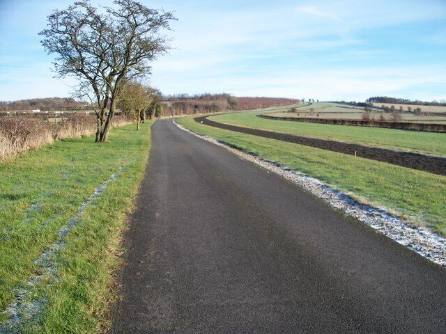 Jackdaws Castle Set in 500 acres, Jackdaws Castle is where Jonjo O'Neill runs his horse training establishment. The road seen here is the route of two long distance footpaths, the Gloucestershire Way and the Diamond Way, running through the property. The track seen to the right of the road is an all-weather gallop.