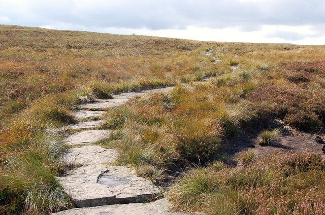 Stone slabs path on the Hay Bluff plateau Offa's Dyke path gains the plateau here before making a lengthy descent to the SE. Although a man-made addition, the stone-slabbed route cuts down on erosion and makes for almost effortless progress compared with the alternative of walking across miles of heathery tussocks.
