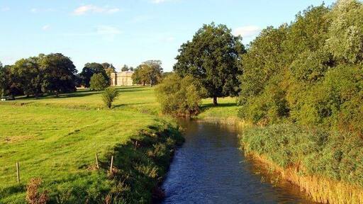 Turvey House View of the house, built in 1794, amid its lush parkland from the bridge over the Great Ouse.