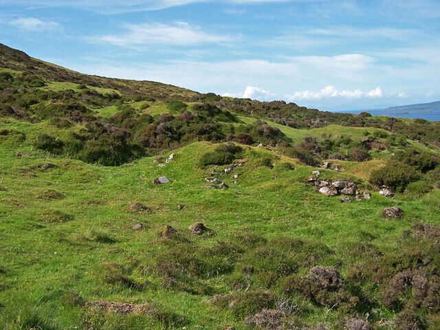 Shieling hut remains Grassy mounds and small sections of dry stone walling are all that remain of a large group of about sixteen shieling huts here on the eastern slope of Beinn na Crèiche. The remains are recorded on the Highland Environmental Record website - http://her.highland.gov.uk/SingleResult.aspx?uid=MHG4795 .