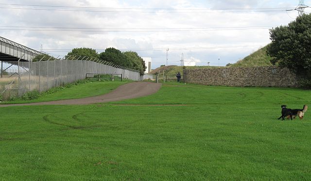 Path off Preston Links Path and trackway, supposedly gated to prevent vehicles occupying the green space, but not at this visit. The power station conveyor on the left. This green space is popular for exercising dogs.
