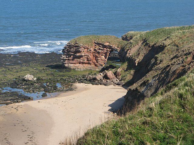 Natural arch near Bilsdean Is this East Lothian's finest beach? It is hard to access, with steep crags and grass slopes separating it from the John Muir Way path above. The arch is close to collapse now, there has been fresh rockfalls, so this is a good example of a catching a stack about to be formed. Obviously visiting the site requires some care.