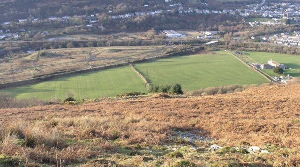 Swansea valley from Darren Fach A good view of most of this square from Darren Fach. You can clearly see the course of the old Swansea to Brynaman branch run diagonally through the picture. This is now part of the Sustrans cycle path network. What's less easy to see (but it's there if you look carefully) is evidence that there was once a railway junction right in the centre of the picture. Look very carefully at the fields to the right and you'll see a slight raised line run through them. This in fact is the original junction and course for the Vale of Swansea line to Brecon.