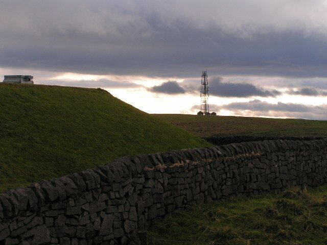Reservoir and mast, Peaslows. Looking south from the roadside at SK085807. The mast holds radio and mobile phone antennae.