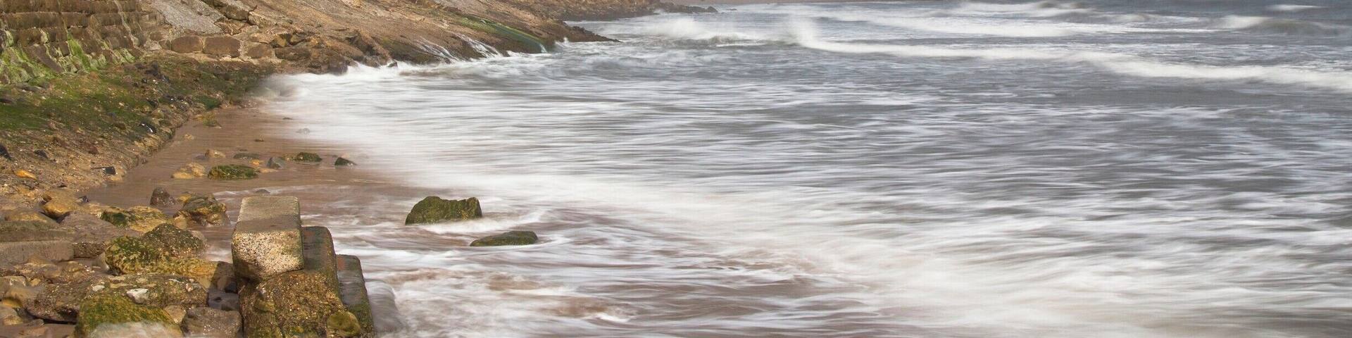 Tide on the turn at Cayton Bay just north of Scarborough North Yorkshire...The shot was slowed down to show the milky sea...
