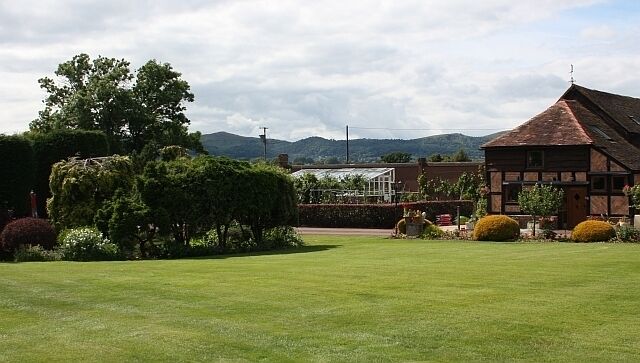 Garden of Little Welland Farm With beautiful views of the Malvern Hills in the distance.