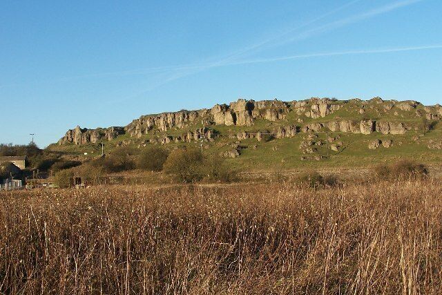 Harbro' Rocks. Harbro' Rocks is a limestone outcrop on a high point on the limestone plateau. The magnesian limestone is particularly soft and well weathered making it a popular spot for novice climbers. There is a carved stone chair on the ridge which has magnificent views over what is now Carsington Reservoir, unfortunately it was seriously vandalised recently. Its origin is apparently a mystery.