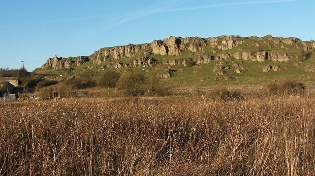 Harbro' Rocks. Harbro' Rocks is a limestone outcrop on a high point on the limestone plateau. The magnesian limestone is particularly soft and well weathered making it a popular spot for novice climbers. There is a carved stone chair on the ridge which has magnificent views over what is now Carsington Reservoir, unfortunately it was seriously vandalised recently. Its origin is apparently a mystery.