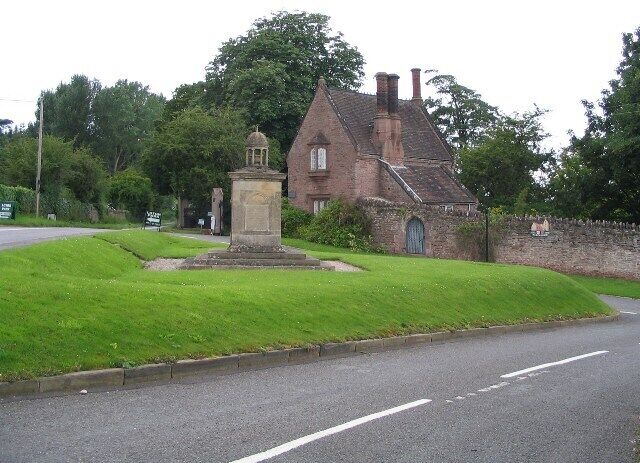 The English Lodge and war memorial, Alberbury. The war memorial stands on the T-junction of the lane into Alberbury and the B4393 (to the left). The English Lodge is the partner to the Welsh Lodge ( 462517 ) a little further up the B4393, which is closer to the Welsh-English border but not in Wales. Both lodges are associated with Loton Park estate.