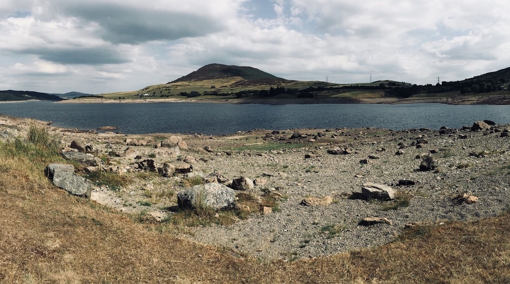 Llyn Celyn Resevoir, Snowdonia North Wales. Water lever extremely low due to our dry spell in the UK.
lyn Celyn is a large reservoir constructed between 1960 and 1965 in the valley of the River Tryweryn in Gwynedd, Wales. It measures roughly 2.5 miles long by 1 mile wide, and has a maximum depth of 140 ft.