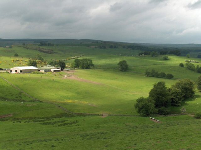 Murrayshall Farm and Castlehill. Castlehill is the sunlit area to the right of the farm. A ruin there can just be seen but is not recognisable as such in the photo.