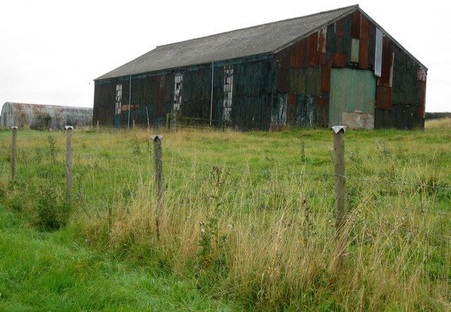 Building adjacent footpath to Orford. I presume this was once a workshop of some description judging by the size of the windows.