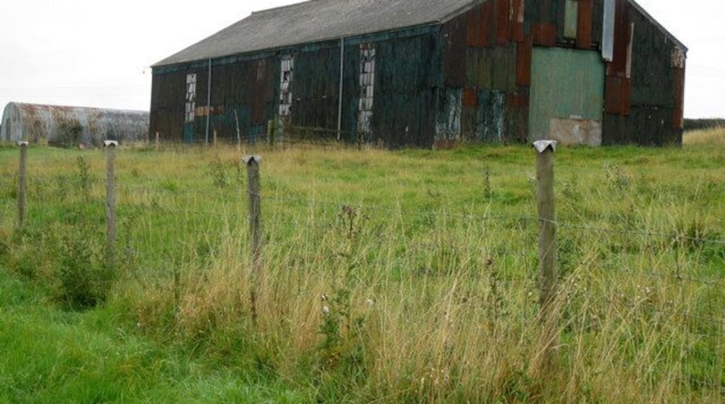 Building adjacent footpath to Orford. I presume this was once a workshop of some description judging by the size of the windows.