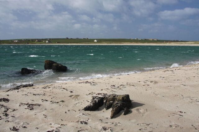 South coastline of Burray Looking across Water Sound from the sandy beach on the south coast of Burray. In the distance is the Ayre of Cara on South Ronaldsay.