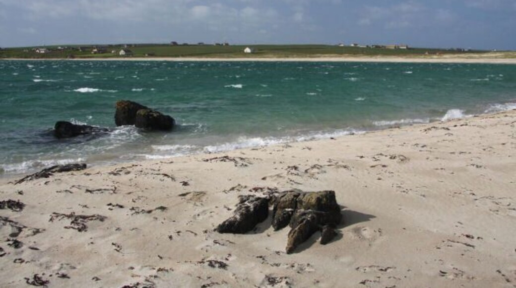South coastline of Burray Looking across Water Sound from the sandy beach on the south coast of Burray. In the distance is the Ayre of Cara on South Ronaldsay.