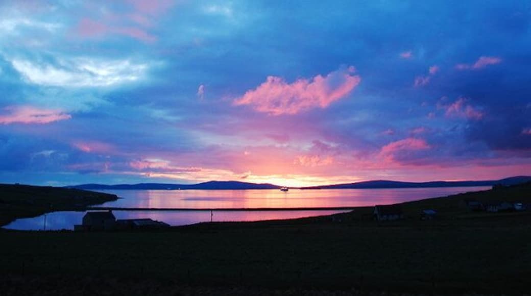 Echna Loch Sunset The view from my living room window. Echna Loch with Scapa Flow beyond.