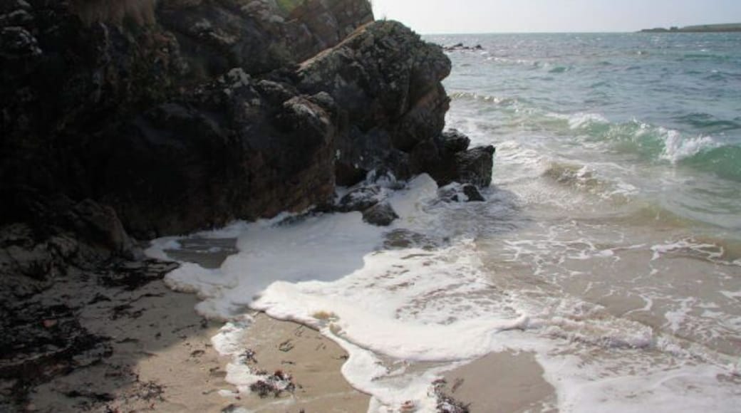 Cliffs at end of beach The short section of sandy beach on Burray's southern shore, east of Churchill Barrier No. 4, ends abruptly with a low cliff and rocks that inhibit further eastward access.
