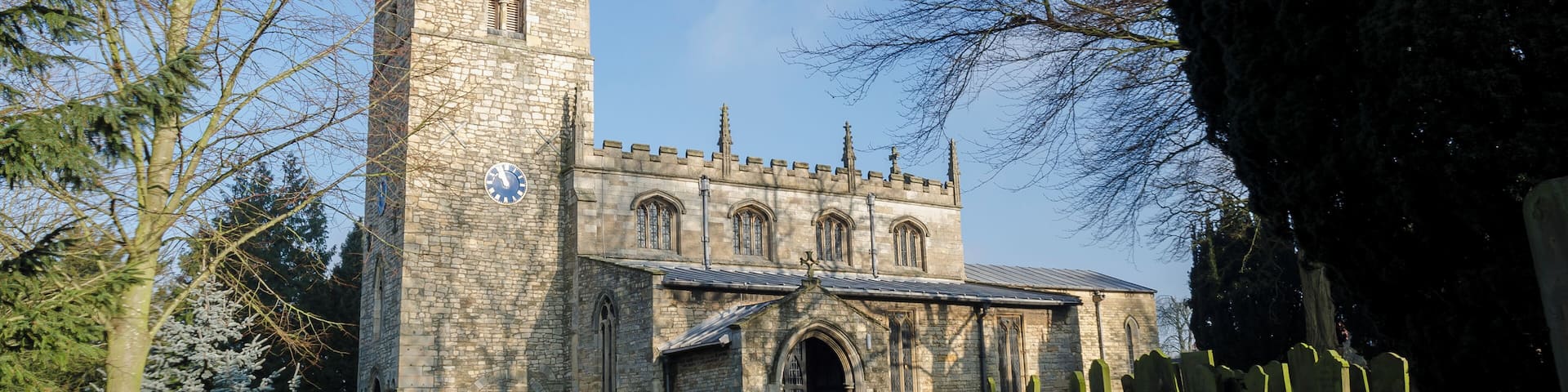 Originally an 11th C. church with west tower from 11th and 12th C. 13th century font and inner south doorway, 14th century south aisle and south porch, 15th century seating and chancel plus new nave roof and clerestory, tower parapet and spire. 1864-1875 saw new north aisle, outer wall of porch removed and rebuilt, porch roof repaired, pipe heating installed, all floors and seating removed and redone and the gallery which had partially blocked the tower arch and accommodated the choir was removed. 1888 the church clock was installed. 1893 Chancel alterations and organ installed built by Henry Willis & Sons Ltd. 1895 Restoration of belfry and spire, spire taken down as unsafe – the stones were numbered and replaced in original position at cost of £324. 1912-13 New roof to south aisle and porch and extensive repairs to nave roof plus vital work to the tower at cost of £740. 1962 On Christmas day it is believed that a mouse chewed through an electricity cable which caused a devastating fire destroying the chancel and organ (fire believed to have originated in the organ), causing much smoke damage in the rest of the church which can still be seen on the arches and the cross which buckled in the fire is on display in the church. 1966 The church was rededicated with new chancel, new east end stained glass window and new organ built by Messrs Cousans (Lincoln) Ltd. The total cost was £44,000 (of which £35,000 was paid for through insurance). 2011 After numerous lead thefts from roof, a new roof is being installed at a cost of £35,000 made of terne coated steel with no resale value.