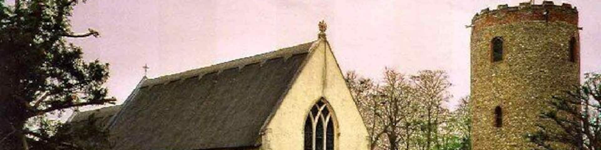 St Andrew's Church, Bramfield, Suffolk. Bramfield is about 2 miles south of Halesworth on the A144 road. The church lies just behind the Queen's Head Public House on the west side of the road. Churches with round towers are rare in Britain apart from Norfolk and Suffolk. Although there are nearly 200 examples in these counties, the tower of St Andrew's is unique in Suffolk as it is detached from the church. The tower is probably Norman around the 12th Century and is 43 foot 6 inches high and with wall thickness of 4 foot 6 inches. There are 5 bells the earliest dating from 1440. The church itself is entirely 14th century and replaced one that was mentioned in the Domesday Book of 1086. http://www.suffolkchurches.co.uk/bramfield.htm