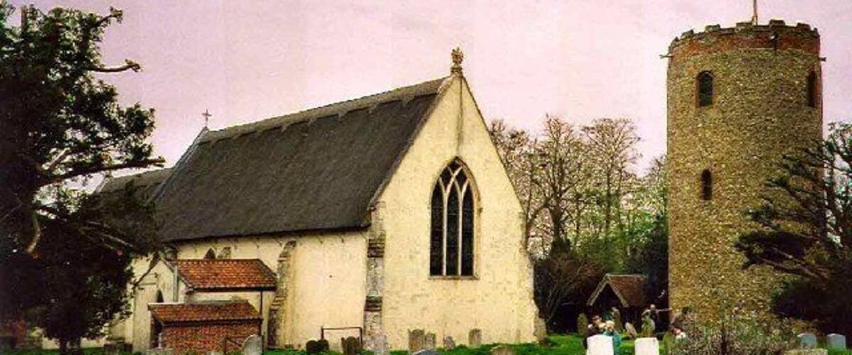A church with a tower and a graveyard.