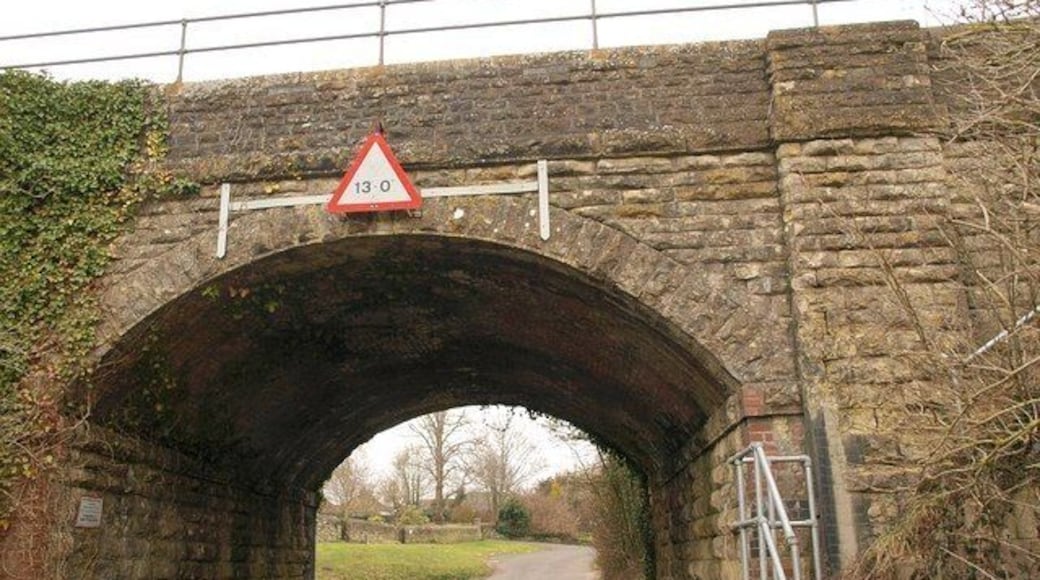 Railway bridge, Bradford Abbas Once, this railway bridge carrying the Waterloo line across Westbury would have been near the northern edge of the village. Now, since, most recent development has taken place north of it, it is nearer the southern edge. Bishop's Lane, which leads past two closes of such modern houses, turns off to the left just beyond the bridge.