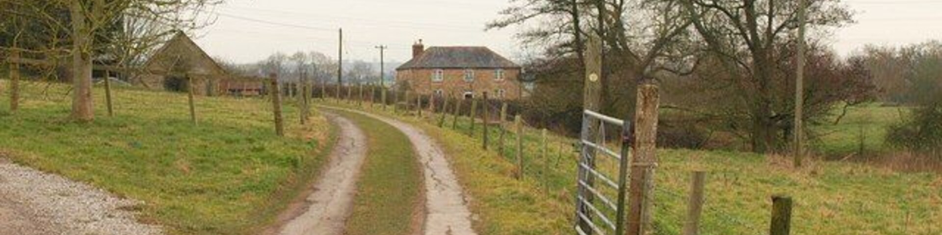 Footpath at Bradford Abbas Public footpath N6/4 leaves the road northeast of Smith's Bridge, heading past The Old Mill along this track. The trees on the right are on the line of the old mill tail, returning water from the mill leat to the nearby River Yeo.