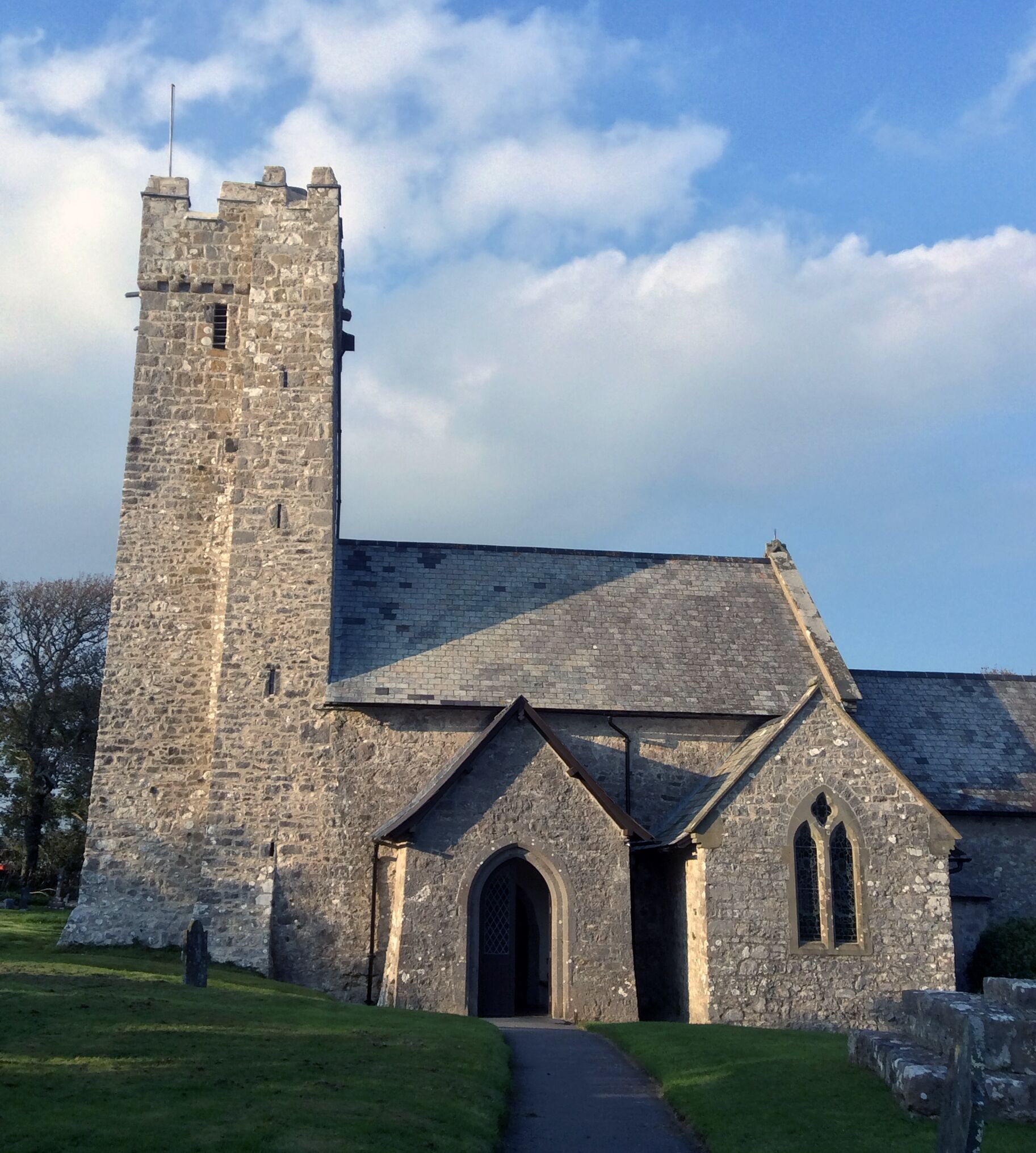 Saint Michaels all Angels Church is an example of a Norman church that can be found all over England and Wales.  The Normans were just another of many peoples who tried to invade Wales.  It could be said that almost all failed (Edward I forced Wales into submission, but some would say he never fully succeeded). 

Here are some links for Norman and Edward I histories
http://www.bbc.co.uk/wales/history/sites/themes/guide/ch6_coming_of_the_normans.shtml
https://en.wikipedia.org/wiki/Edward_I_of_England
#hiking