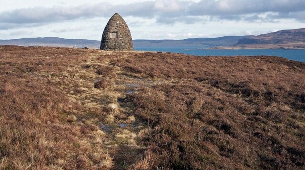 The MacCrimmon Memorial. The Memorial to the famous piping dynasty of MacCrimmons above Loch Dunvegan. The MacCrimmons were hereditary pipers to the Chiefs of Clan MacLeod of Dunvegan, and composed many classical pieces of music in their honour, as well as founding a renowned school of piping at Borreraig. The 17th Century was the high point of their acclaim, with their last pupil, a MacArthur, graduating in the 1780s. The cairn pictured was built in 1933, paid for by Clan Societies and donations from around the world. View 1129577 , Detail 1129586.