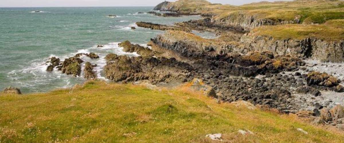 Yr Ebolion and Caseg Malltreath Yr Ebolion is the rocky point in mid photo, with Pen y Parc beyond, and Caseg Malltreath is the islet almost awash just below the horizon to the left.