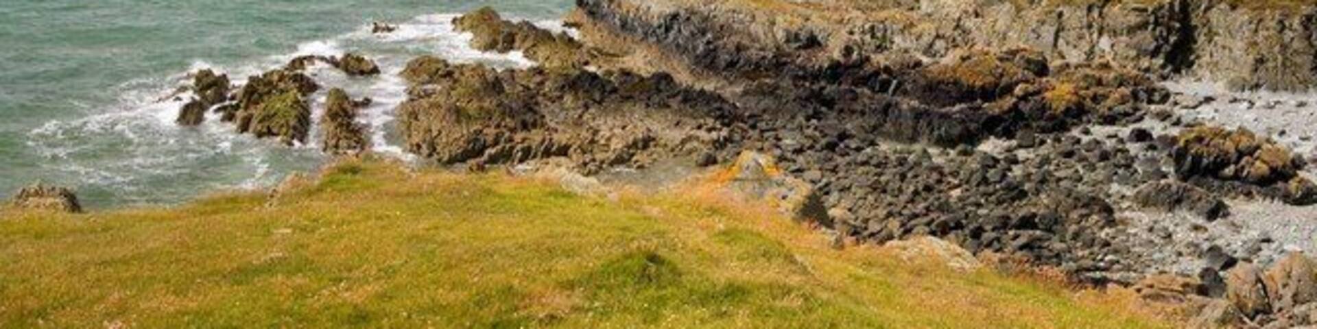 Yr Ebolion and Caseg Malltreath Yr Ebolion is the rocky point in mid photo, with Pen y Parc beyond, and Caseg Malltreath is the islet almost awash just below the horizon to the left.