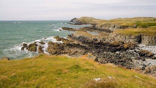Yr Ebolion and Caseg Malltreath Yr Ebolion is the rocky point in mid photo, with Pen y Parc beyond, and Caseg Malltreath is the islet almost awash just below the horizon to the left.