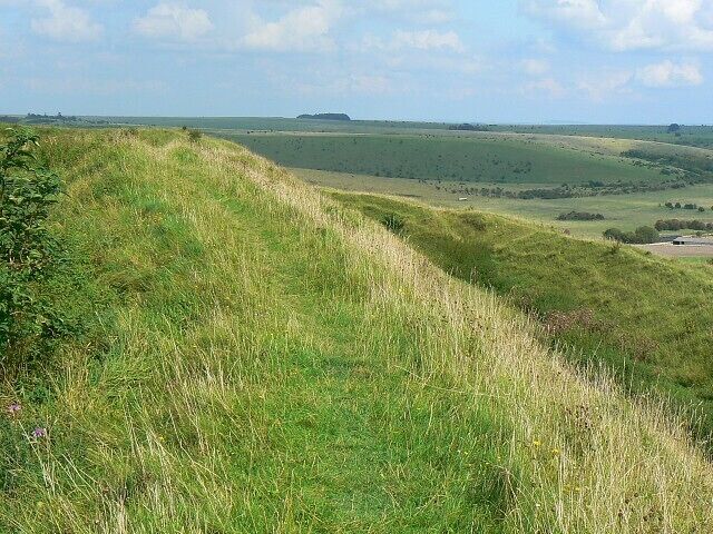 Earthwork, Battlesbury Hill, near Warminster This image shows the south-eastern edge of the hill fort ditch. The path runs along the top of the inner wall of the ditch with the lower outer wall to its right. Beyond lies the Imber range part of the Salisbury Plain military training area.
