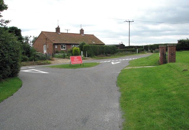 Church Lane meets Church Road. Or Yarrow Road, depending on which way one turns: Church Road is at left, Yarrow Road at right. Church Lane leads past the new section of the cemetery > 893327 which is located opposite (just west of) St Swithin's church > 893331 but not contained within the churchyard.
