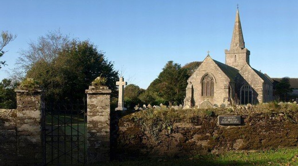 St. Lawrence's church, Bigbury "C14 and C15 but '... all but rebuilt by J Sedding in 1872' (Pevsner) " http://www.imagesofengland.org.uk/details/default.aspx?id=99593 . The wall and gate piers (these form one of two pairs) are also listed http://www.imagesofengland.org.uk/details/default.aspx?id=99593 .