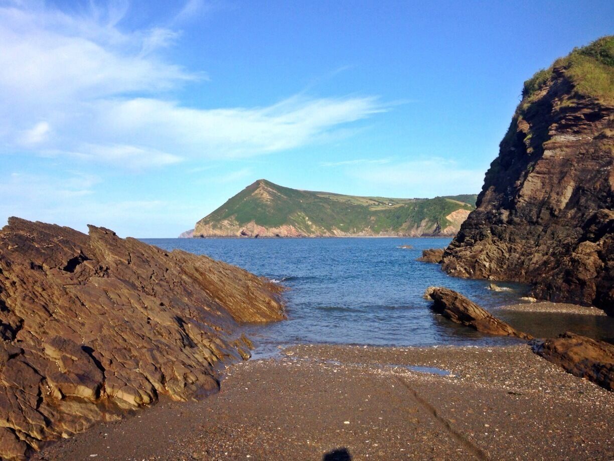 View of Little Hangman from sandbank at low tide at Broadsands Beach. 
