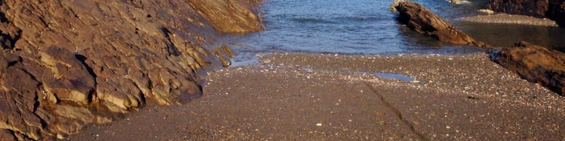View of Little Hangman from sandbank at low tide at Broadsands Beach.